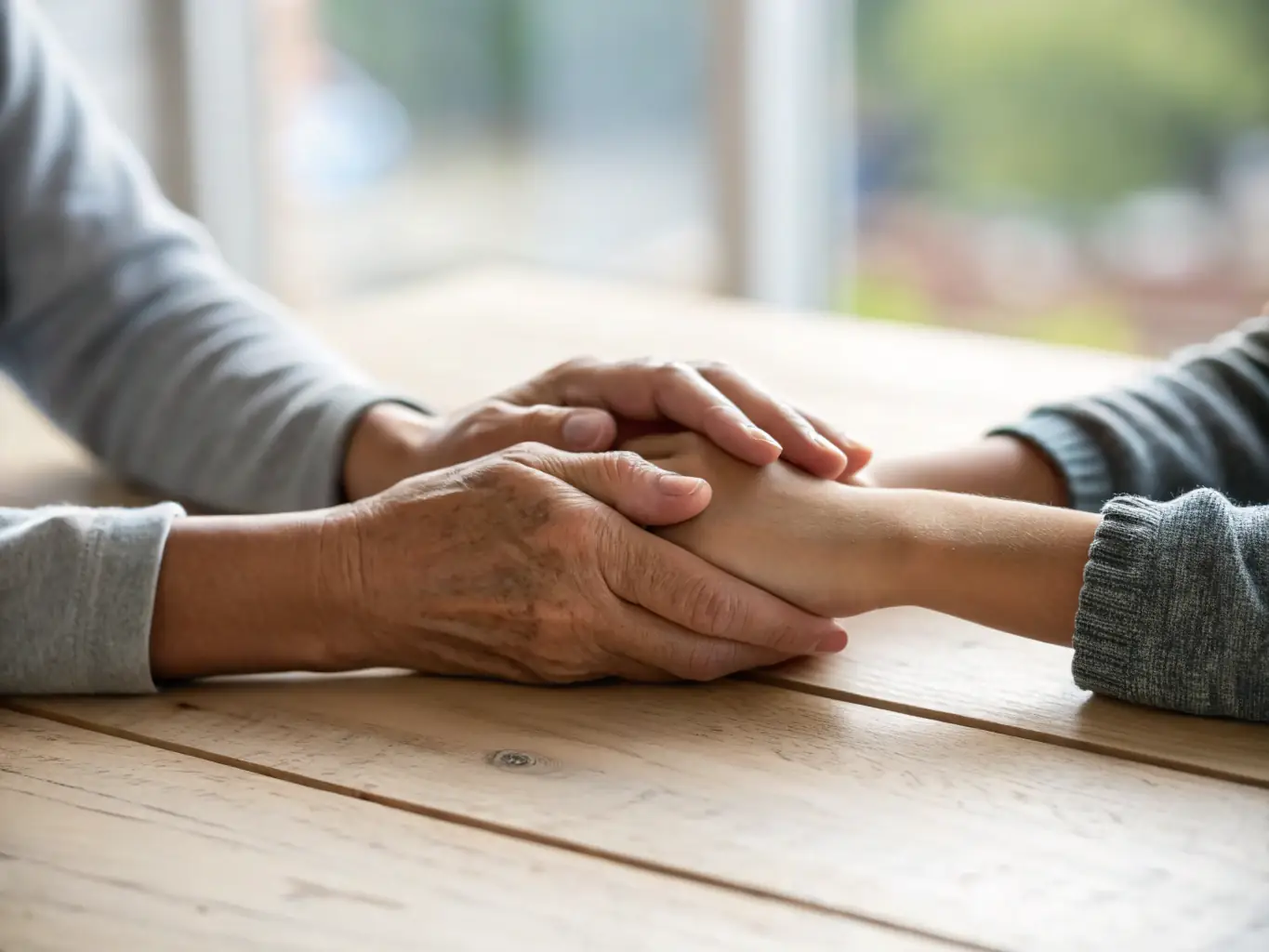 A close-up image of a parent holding a child's hand, symbolizing the importance of child custody and support in family law cases.